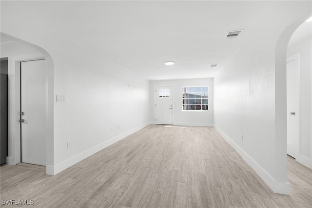 spare room with light wood-type flooring