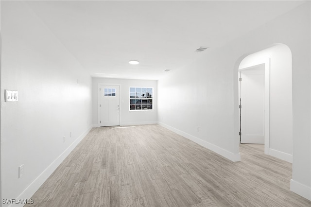 empty room with light hardwood / wood-style floors