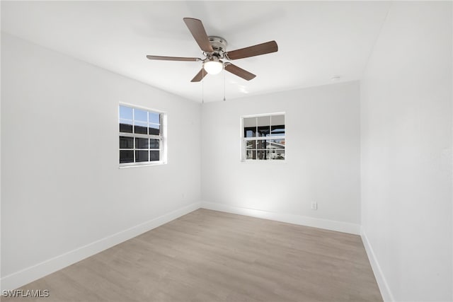 unfurnished room with light hardwood / wood-style floors and ceiling fan