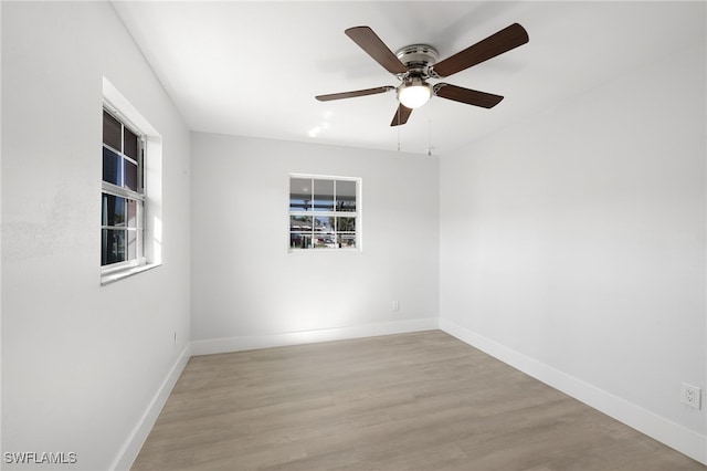 spare room featuring ceiling fan and light wood-type flooring