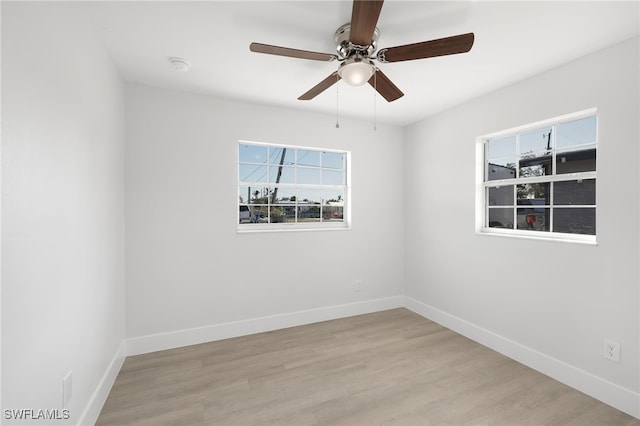 unfurnished room featuring ceiling fan and light wood-type flooring