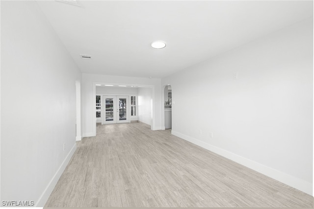 empty room with light hardwood / wood-style floors