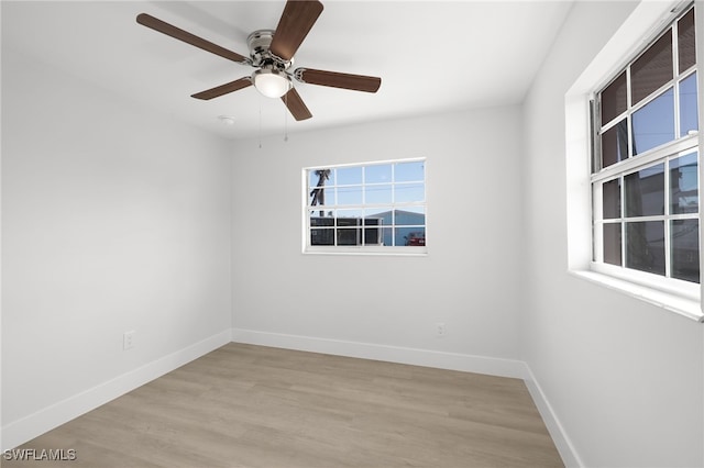 spare room with ceiling fan and light hardwood / wood-style floors