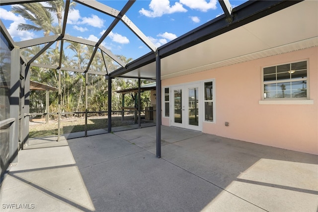 view of patio / terrace featuring glass enclosure and french doors