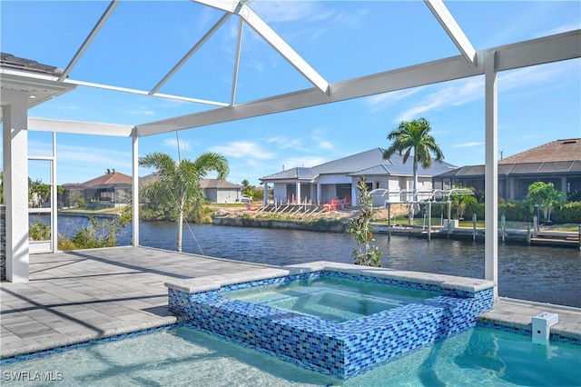 view of swimming pool featuring a lanai, an in ground hot tub, and a water view