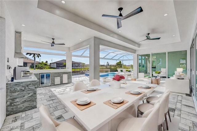 view of patio / terrace with exterior bar, area for grilling, glass enclosure, and grilling area