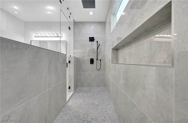 bathroom with tiled shower