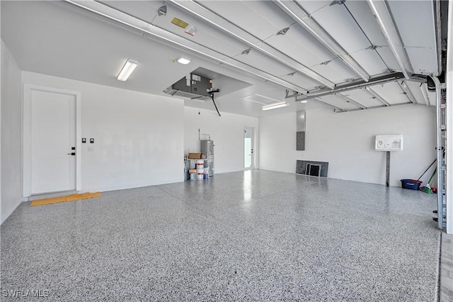 garage with electric panel and water heater