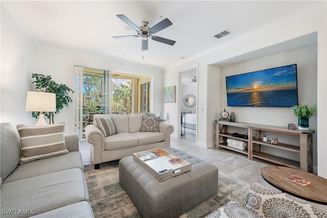 living room with ceiling fan and ornamental molding