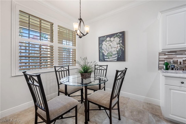 dining area with a notable chandelier and crown molding