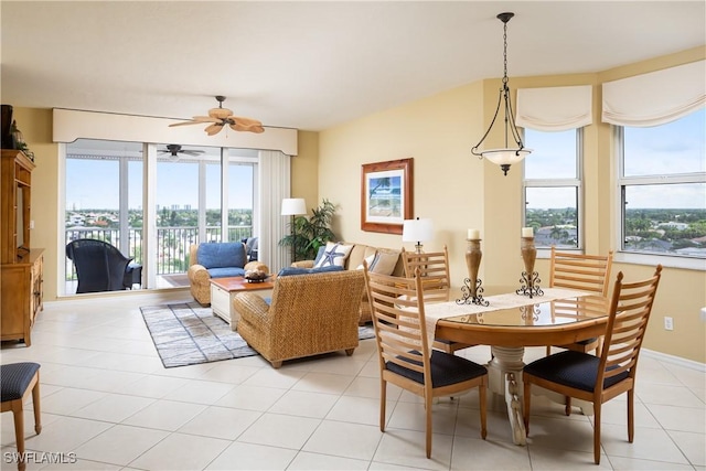 dining space with ceiling fan, light tile patterned floors, and a wealth of natural light