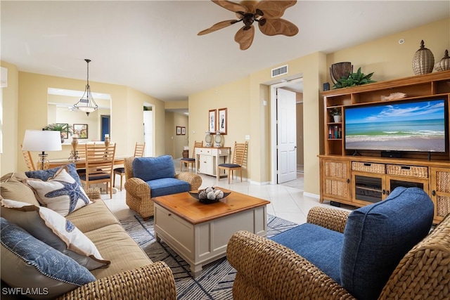 living room featuring ceiling fan and light tile patterned flooring