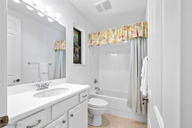 full bathroom featuring toilet, tile patterned flooring, shower / tub combo, and vanity