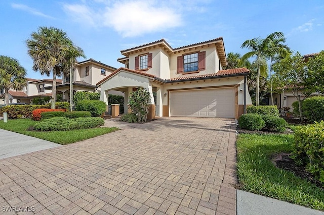 mediterranean / spanish-style home featuring a garage