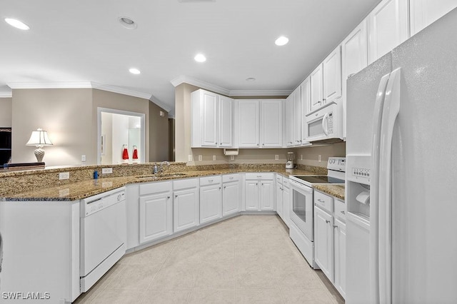 kitchen with sink, white appliances, ornamental molding, white cabinets, and dark stone counters