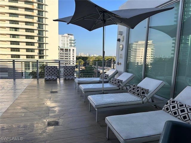 view of patio featuring a balcony