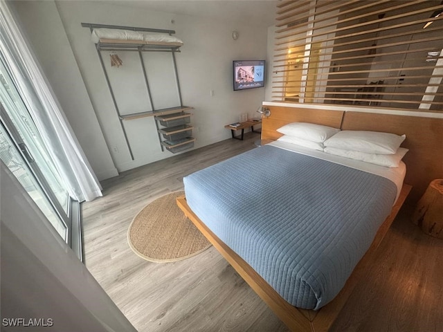 bedroom featuring light wood-type flooring