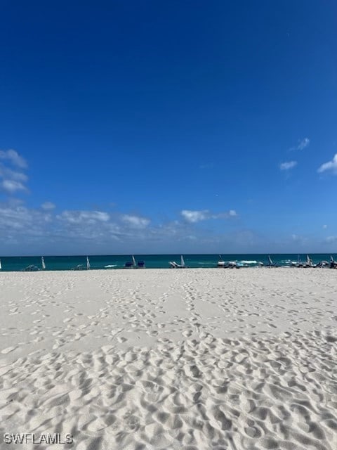 property view of water featuring a view of the beach