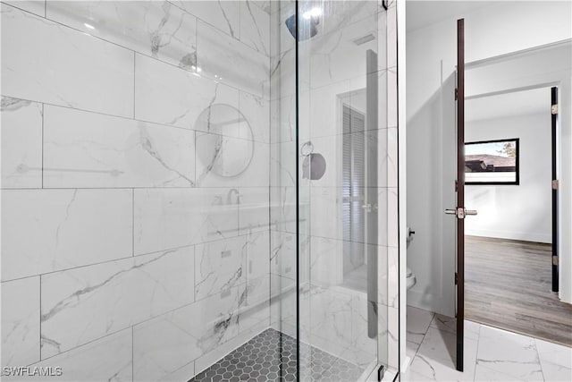 bathroom featuring an enclosed shower