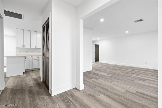 corridor featuring light hardwood / wood-style floors