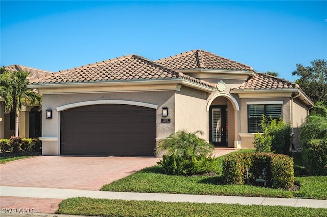 mediterranean / spanish-style house featuring a garage