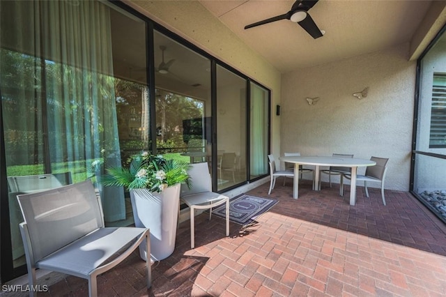 view of patio / terrace featuring ceiling fan