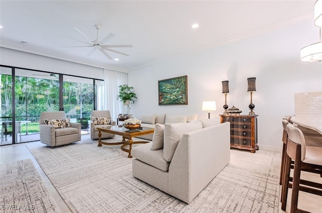 living room featuring ceiling fan and crown molding