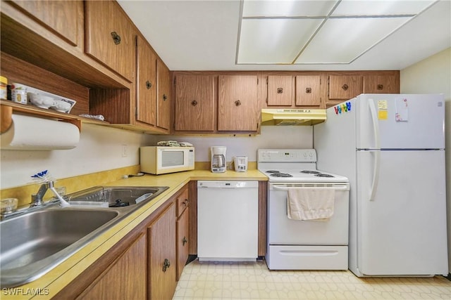 kitchen with sink and white appliances