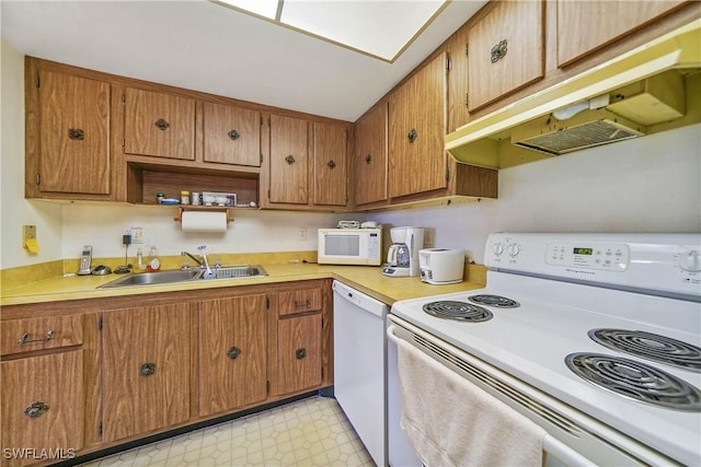 kitchen with sink and white appliances