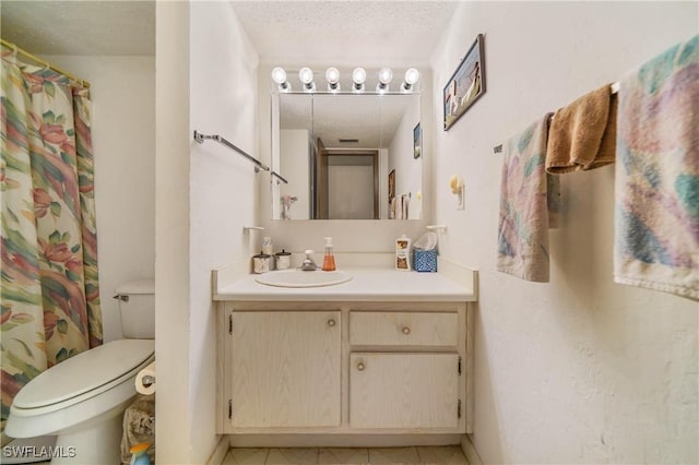 bathroom featuring vanity, a textured ceiling, toilet, and curtained shower