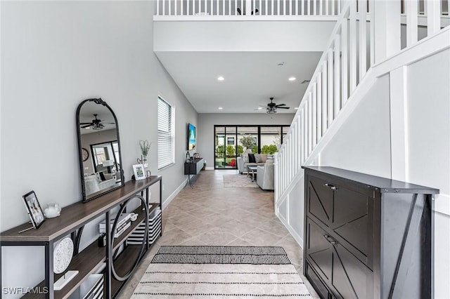 interior space featuring tile patterned floors and ceiling fan