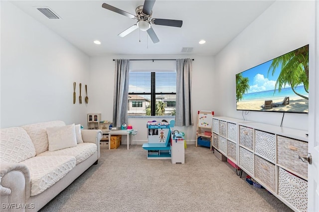 playroom featuring ceiling fan and light colored carpet