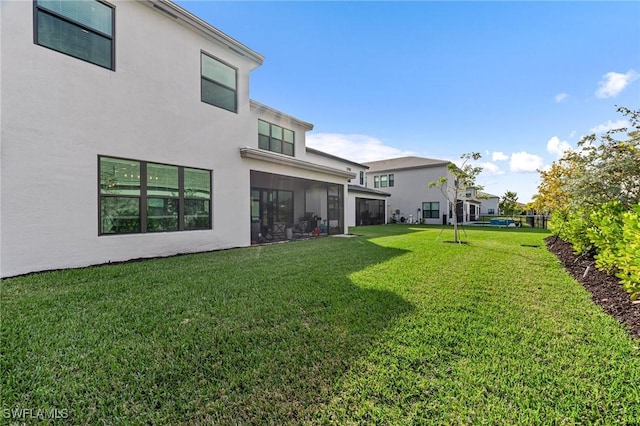 view of yard featuring a sunroom