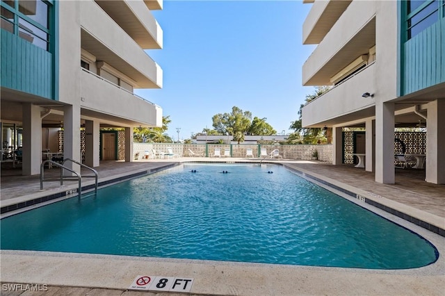 view of swimming pool featuring a patio