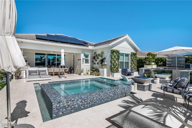 view of pool with a patio area, an in ground hot tub, and an outdoor hangout area