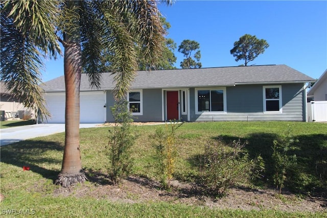 single story home featuring a front lawn and a garage