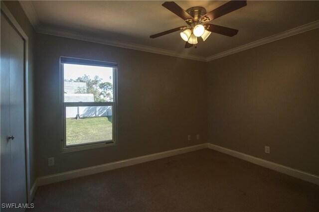 unfurnished room with ceiling fan and crown molding