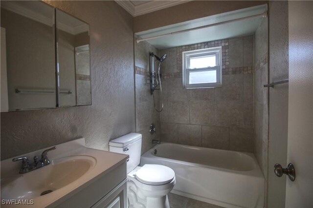 full bathroom with vanity, toilet, tiled shower / bath, and crown molding