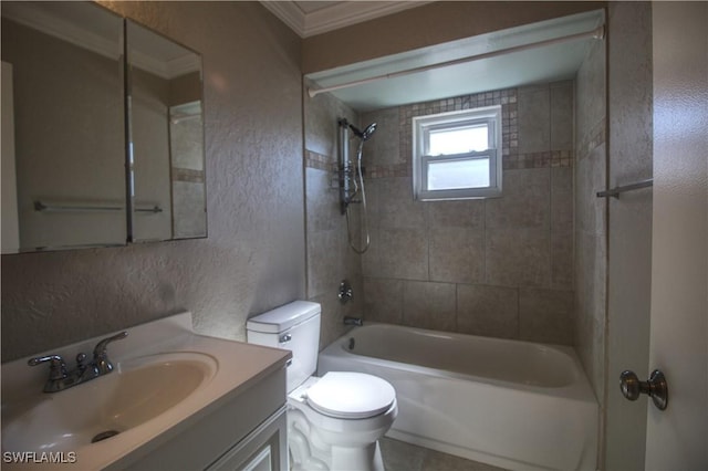 full bathroom with a textured wall, toilet, vanity, washtub / shower combination, and crown molding