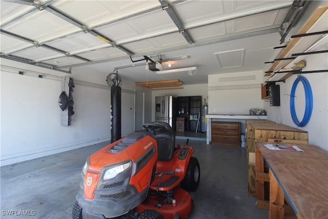 garage featuring stainless steel fridge, water heater, and a garage door opener