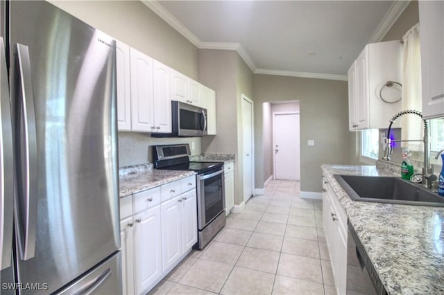 kitchen featuring white cabinets, light stone counters, sink, and appliances with stainless steel finishes