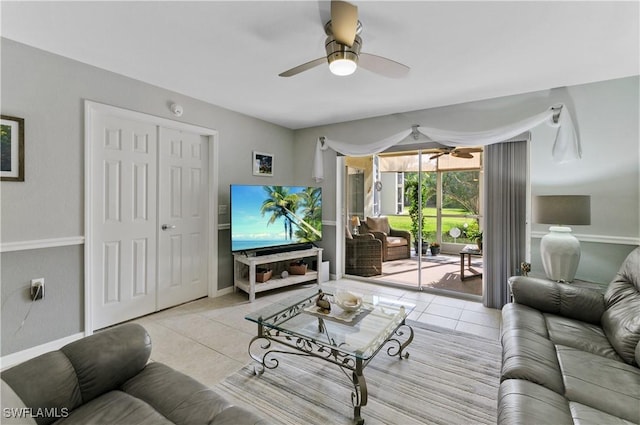 tiled living room with ceiling fan