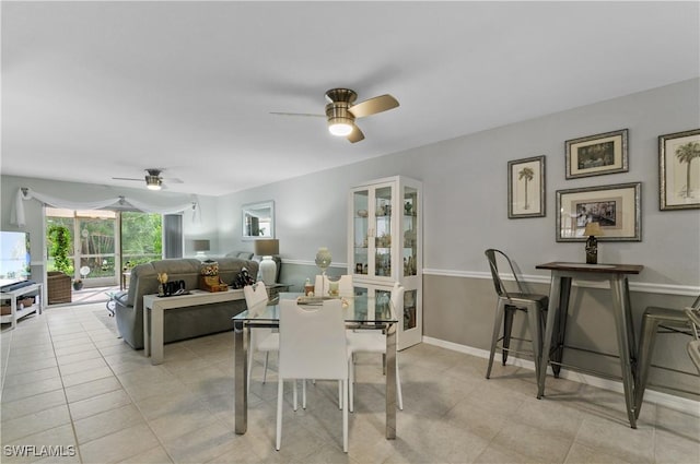 tiled dining room with ceiling fan