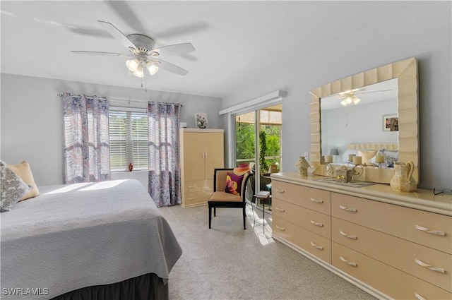 bedroom featuring ceiling fan and multiple windows