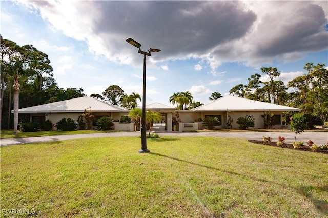 ranch-style house with a front yard