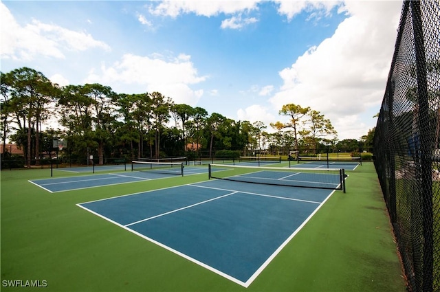 view of tennis court featuring basketball court