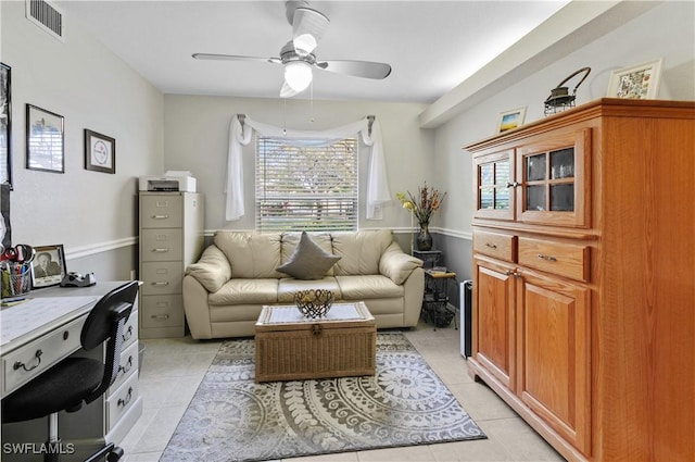 office space featuring ceiling fan and light tile patterned floors