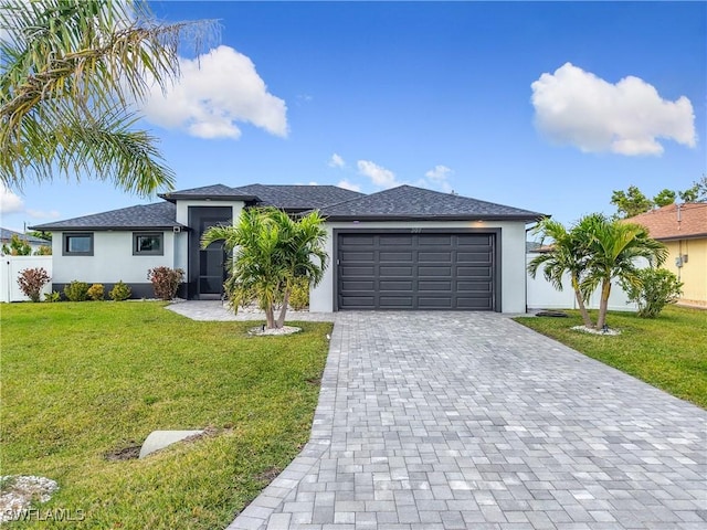 view of front facade with a front lawn and a garage