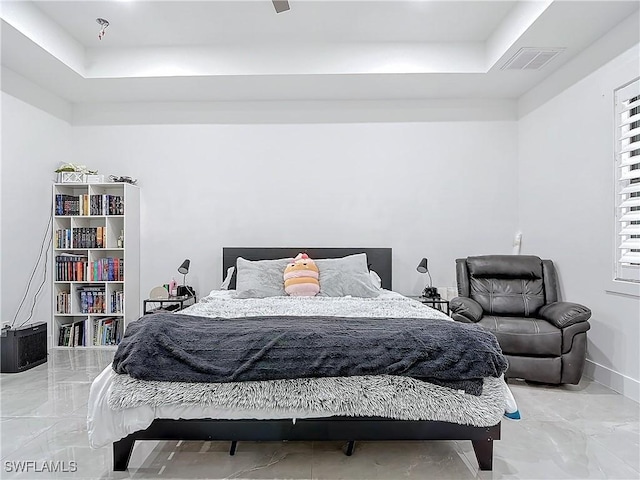 bedroom with a tray ceiling