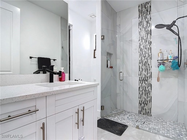 bathroom with vanity and an enclosed shower